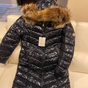 New Women’s Moncler coat with fur hood.